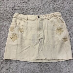 NWT: Lelis Collection Cream Denim Skirt with Flower Patches Size Medium